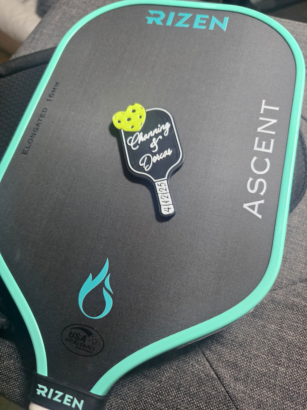 Wedding favor magnet shown on a pickleball paddle for scale