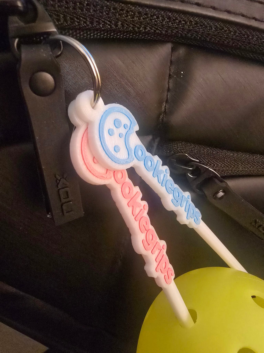 ookie grips ball picker close-up in a pickleball