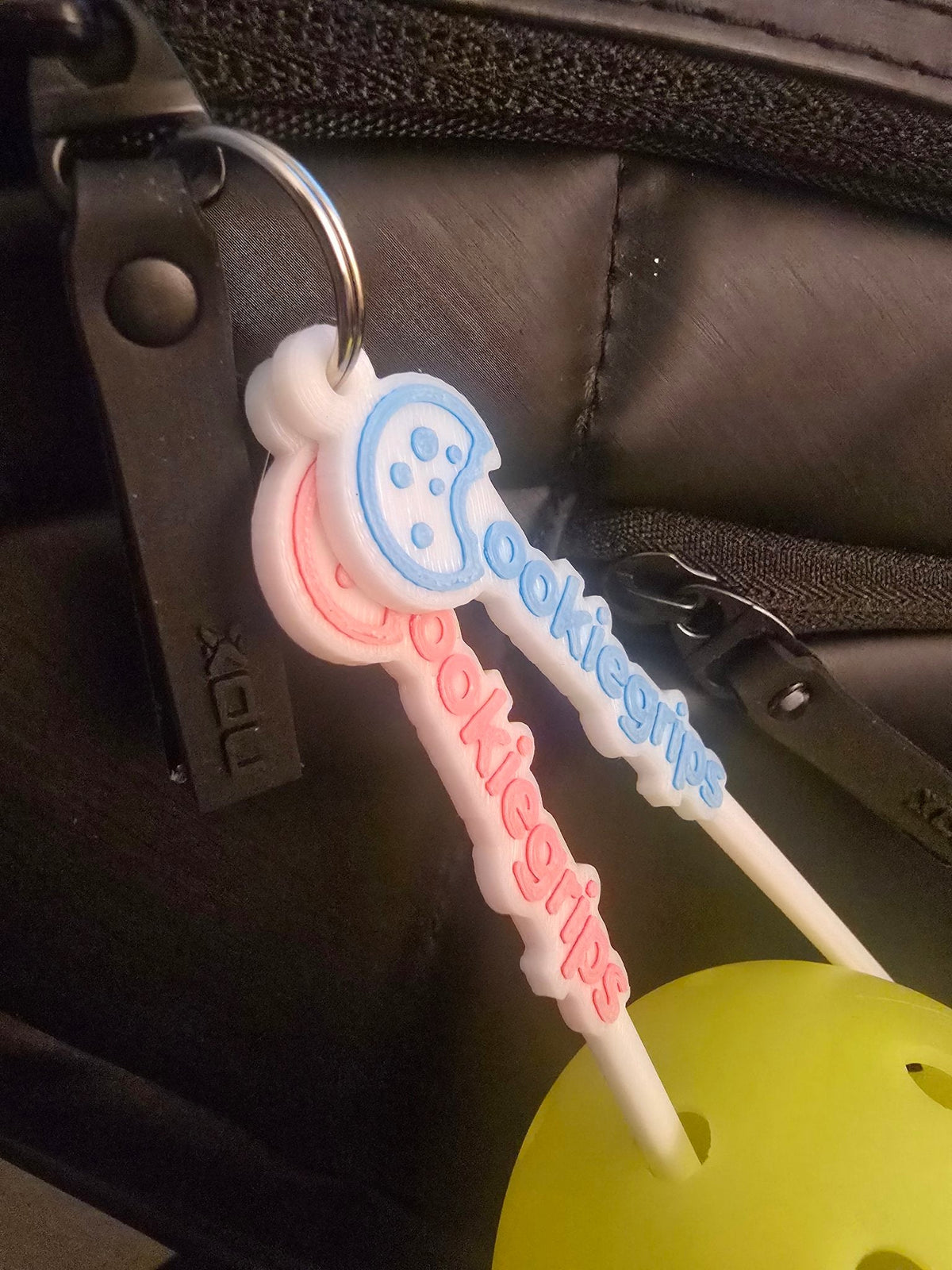 ookie grips ball picker close-up in a pickleball