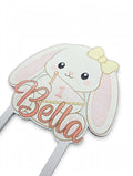 Personalized 3D printed bunny cake topper with custom name and age, front view