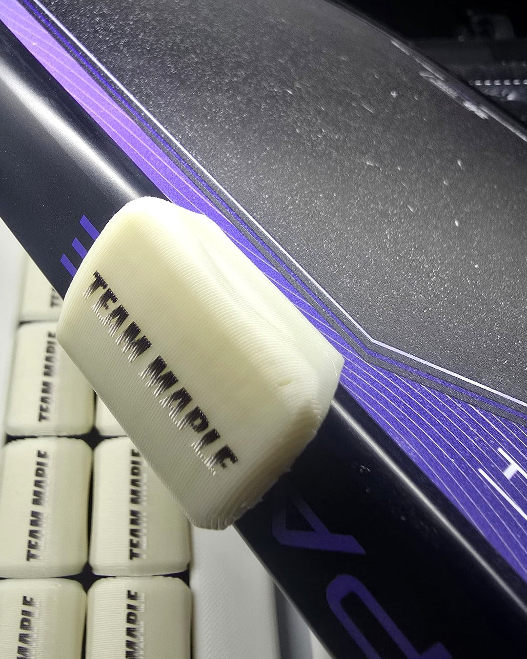 Real cream SNAPS clip custom-printed with TEAM MAPLE on a paddle